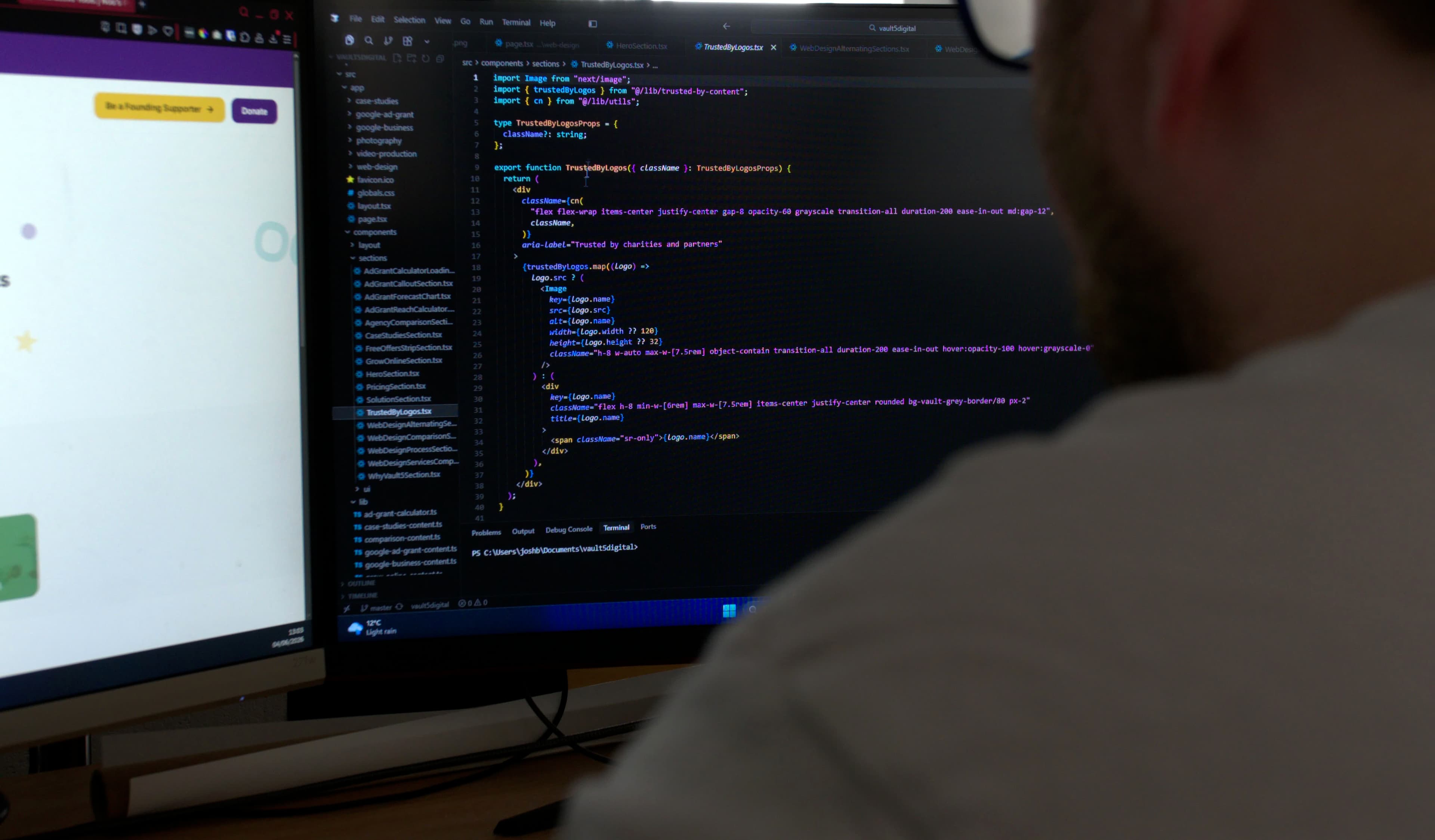 Josh coding a custom charity website