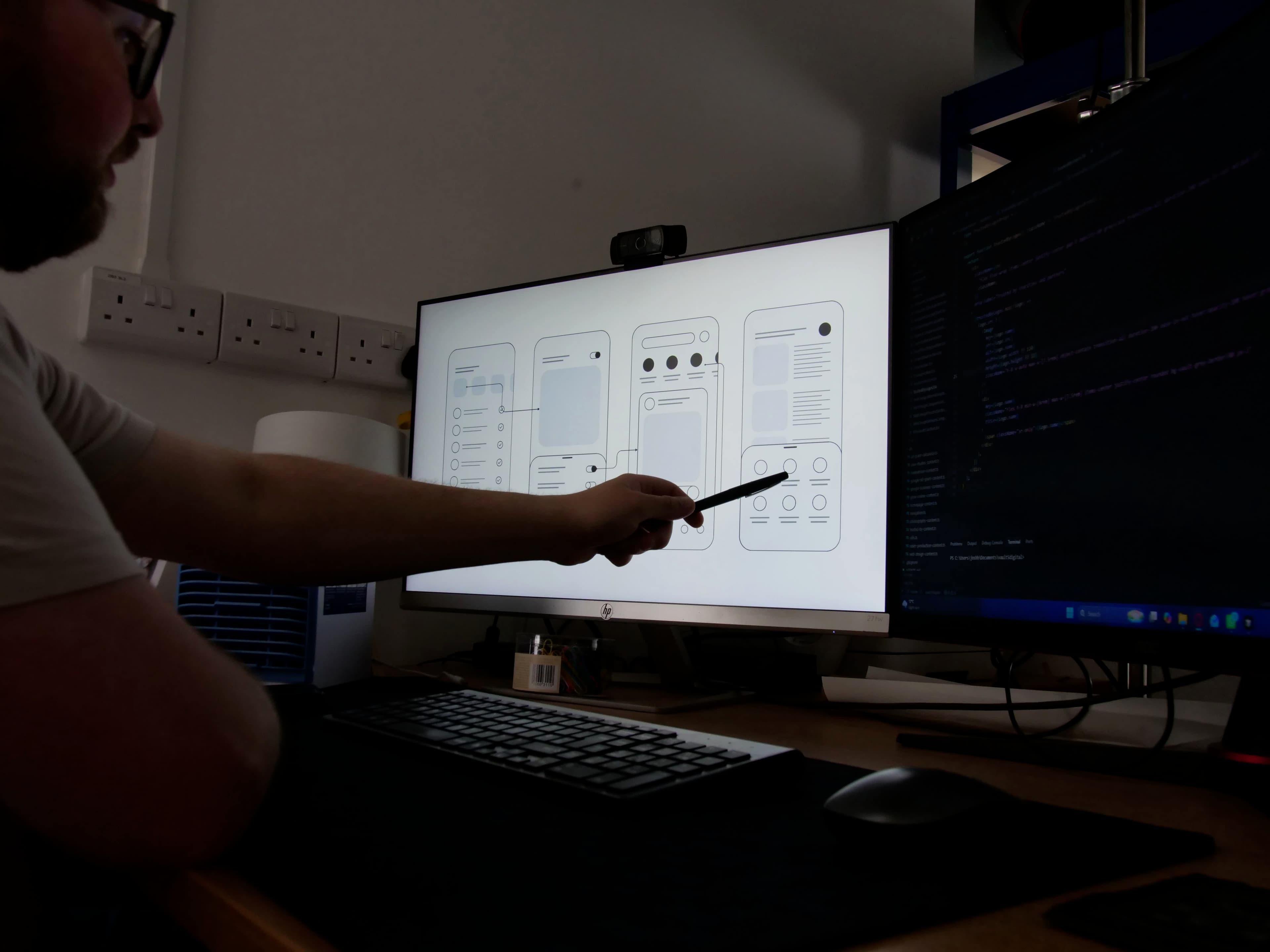 Josh pointing to a charity website on screen during a strategy session