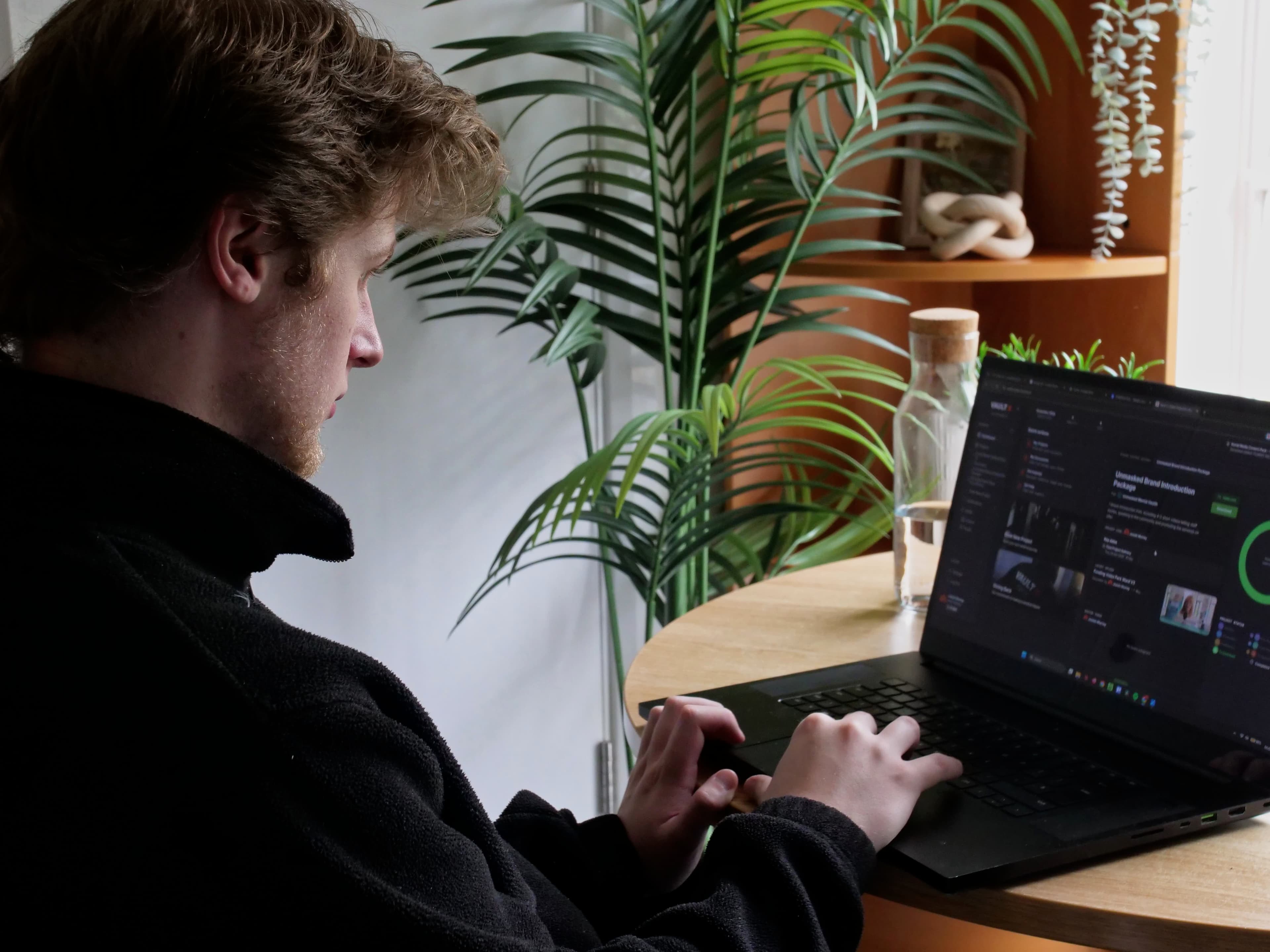 Josiah editing a client charity project in post-production